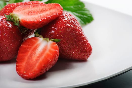 Fresh strawberries in white plate