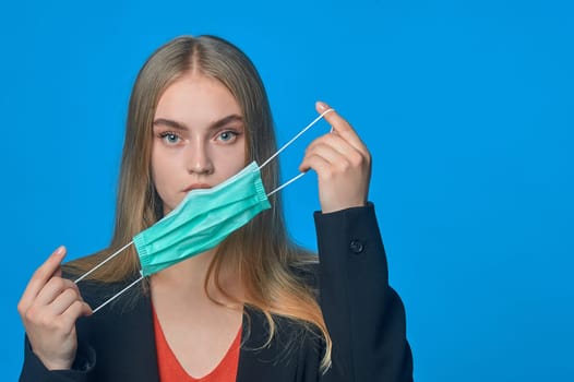 girl with a medical mask on her . High quality photo