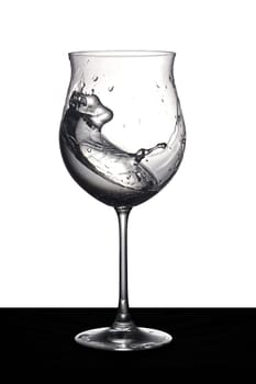 Shaken water in a glass. High quality photo