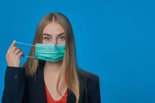 girl with a medical mask on her . High quality photo