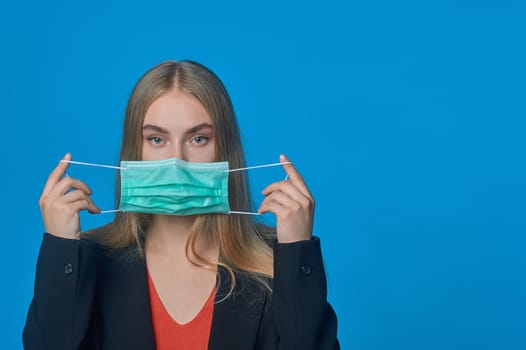 girl with a medical mask on her . High quality photo