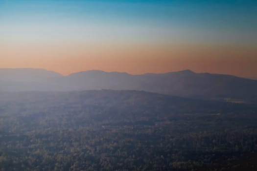 Panorama of a beautiful landscape with mountain ranges at sunset.  At Khao Yai National Park Thailand