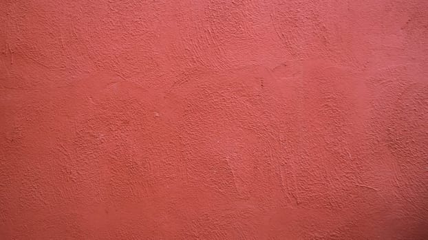 Abstract background from  red stucco concrete wall with sunlight, light and shadow