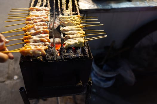 THAI FOOD , Pork Satay on stove .