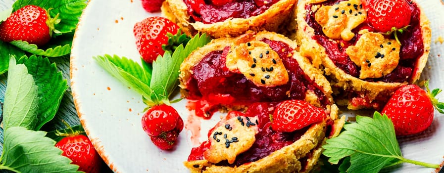 Strawberry shortcake pies on the plate.Tasty tartlets with fresh strawberries.Sweet dessert