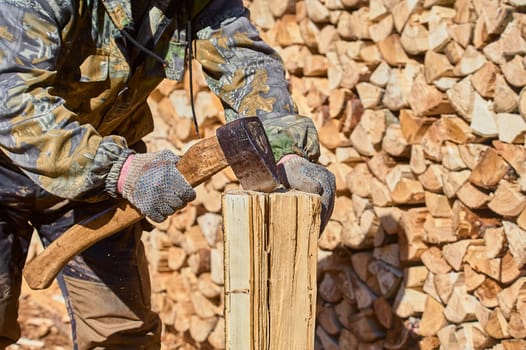 chopping firewood with a chopper close-up on a sunny day. High quality photo