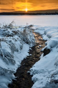 Winter sunset on the river in the month of January. High quality photo