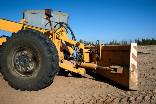 Part of the grader in the Parking lot. High quality photo