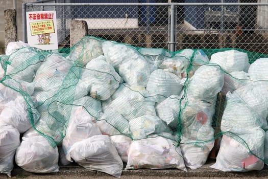 KAGAWA, JAPAN -JANUARY 06, 2016: Sorted garbage bags or waste bag. Designated place to dispose of garbage in Kagawa, Japan.