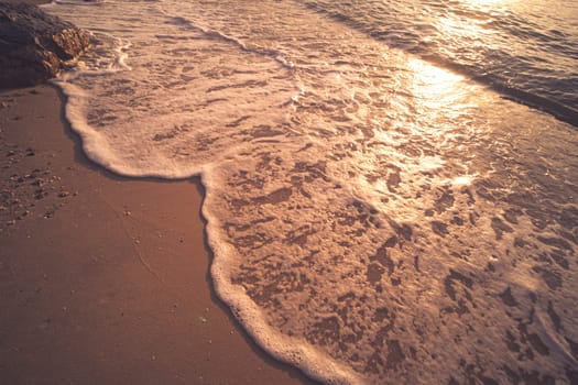 Soft Blue Waves on the beach at the summer time. sea beach blue sky sand sun daylight relaxation landscape viewpoint. The color of the water and beautifully bright clear water.