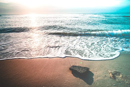 Soft Blue Waves on the beach at the summer time. sea beach blue sky sand sun daylight relaxation landscape viewpoint. The color of the water and beautifully bright clear water.