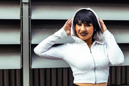 Young cute black hair woman posing with stylish Hoodie
