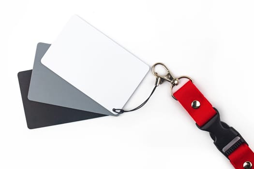 White, gray and black color balance card isolated over white background