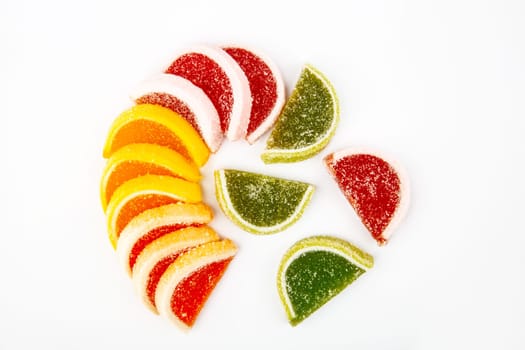 Colourful jelly fruit isolated over white background