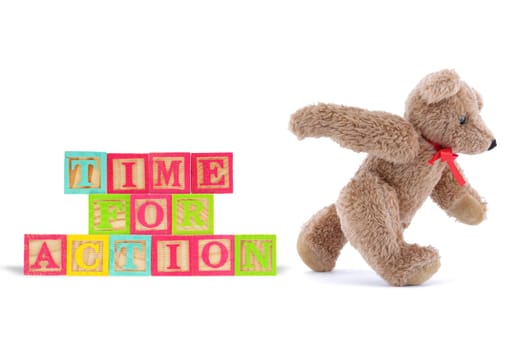 A time for action business concept with wood blocks and teddy bear