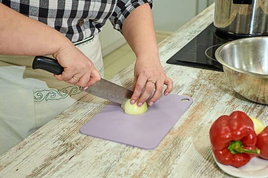Cutting onions when cooking on a Board. High quality photo