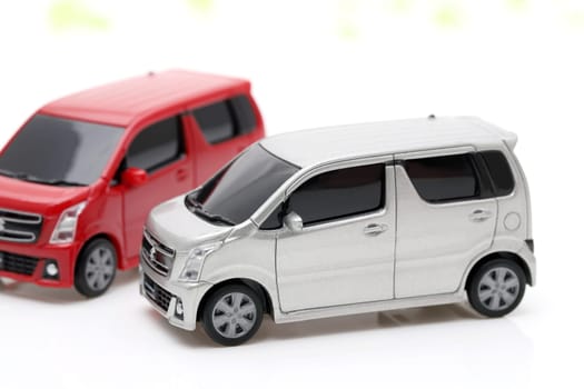 small toy car with red and silver colors isolated on white background