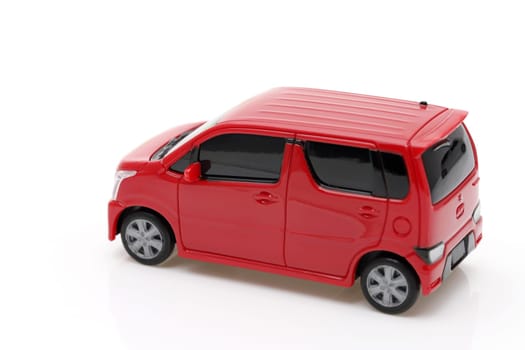 small toy car with red color isolated on white background