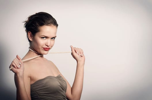 Beautiful young woman in elegant dress