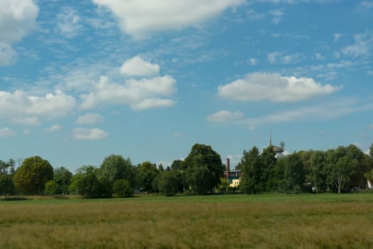 Countryside panorama blue sky Windmill in the background