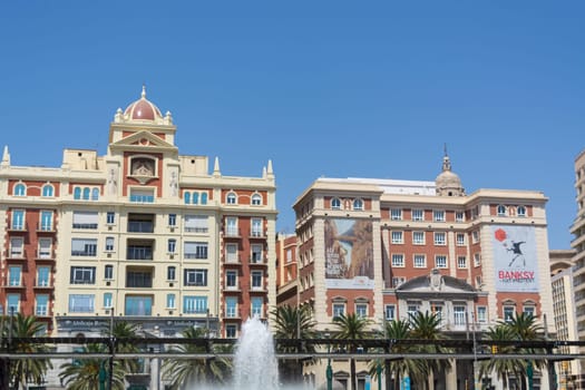 MALAGA, COSTA DEL SOL, SPAIN - AUGUST 31, 2019:.Fountain and Plaza de la Marina, Málaga, Andalusia, Spain, Europe