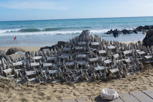 Christmas Village of sand on the beach of Cran Canaria in Meloneras