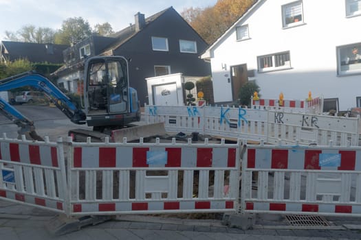 HEILIGENHAUS, NRW - OCTOBER 29, 2019:.Civil engineering works for the installation of gas, water and power lines for a new environmentally friendly fuel cell heating