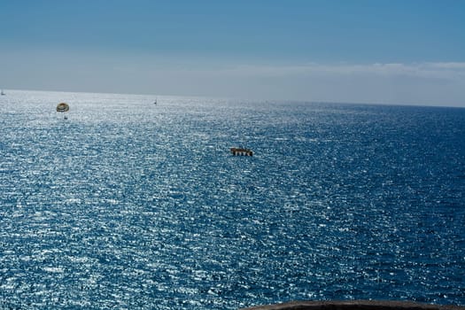 Parasailing, boat parachute. Summer water beach extreme sports..