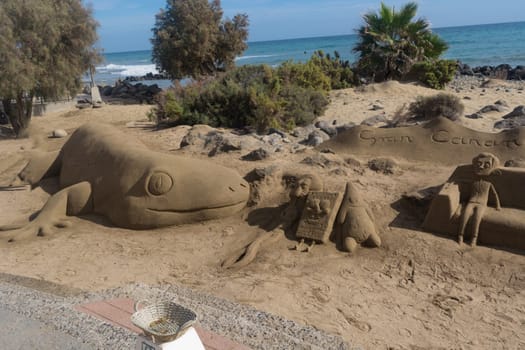 CRAN CANARIA, MELONERAS - 13. NOVEMBER 2019:.Sand sculptures on the beach of Meloneras, Spain with inscription Gran Canaria