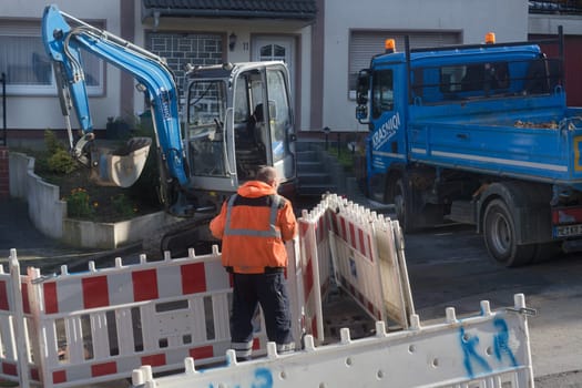 HEILIGENHAUS, NRW - OCTOBER 29, 2019:.Civil engineering works for the installation of gas, water and power lines for a new environmentally friendly fuel cell heating