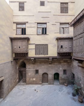 Facade of ottoman era historic house of Zeinab Khatoun with wooden oriel windows - Mashrabiya - located at Azhar district, Medieval Cairo, Egypt