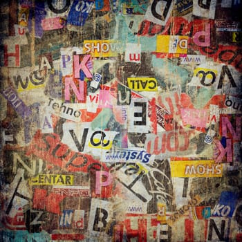 Grunge textured background with old torn newspapers