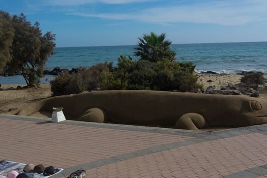 CRAN CANARIA, MELONERAS - 13. NOVEMBER 2019:.Sand sculptures on the beach of Meloneras, Spain with inscription Gran Canaria