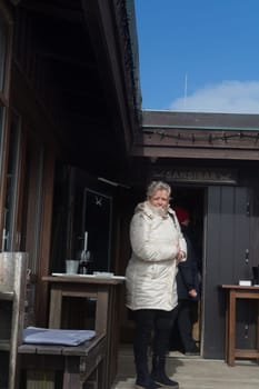 SYLT, GERMANY -MARCH  13, 2020:.Woman at the Beach bar Sansibar, Kampen, Sylt, North Frisia, Schleswig-Holstein, Germany, Europe