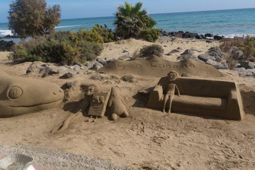 CRAN CANARIA, MELONERAS - 13. NOVEMBER 2019:.Sand sculptures on the beach of Meloneras, Spain with inscription Gran Canaria