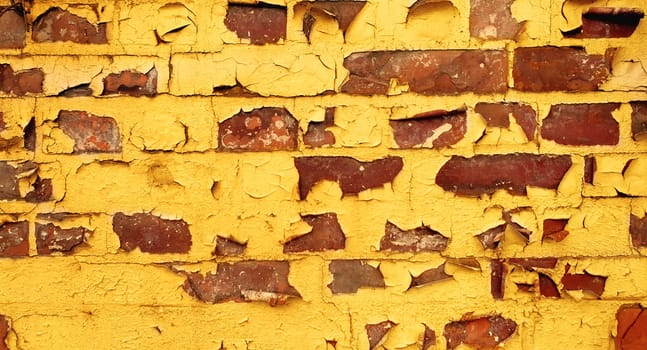 Painted old yellow brick wall for backgrounds