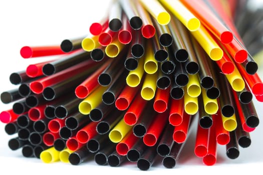 Colorful drinking straws on white background