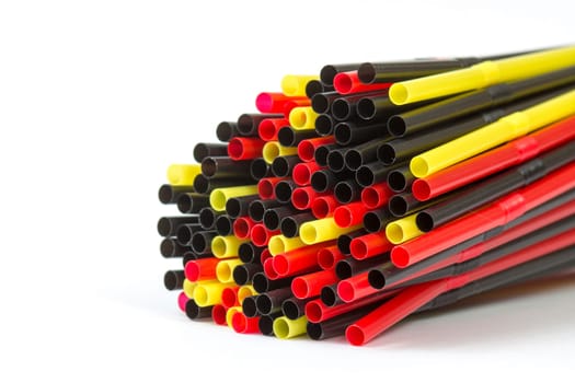 Colorful drinking straws on white background
