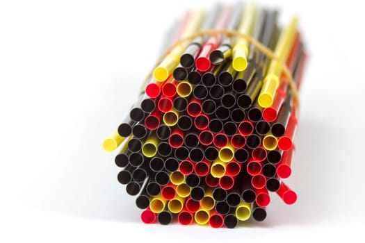 Colorful drinking straws on white background