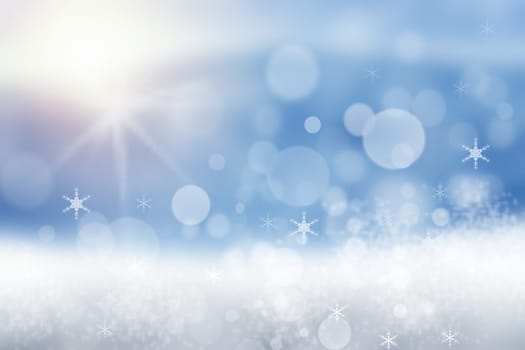 Abstract blurred festive winter christmas or Happy New Year background with shiny blue and white bokeh lighted snow landscape with sky and sun. Space.