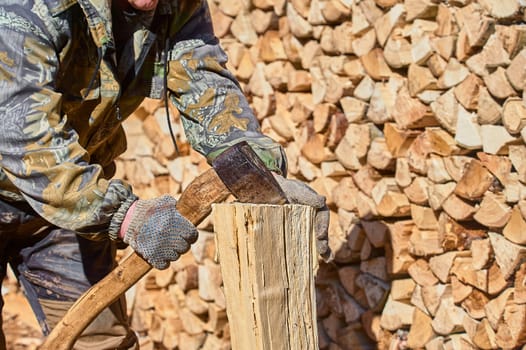 chopping firewood with a chopper close-up on a sunny day. High quality photo