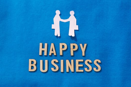 Two Businessman shaking hands on Blue background. Origami Papercraft decorative shapes and figures. Happy Business.