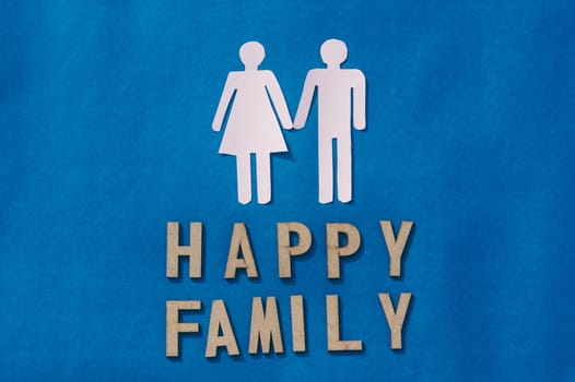 Happy Human Couple Paper Craft Mockup on Blue background. Origami Papercraft decorative shapes and figures. Happy Family Concept.