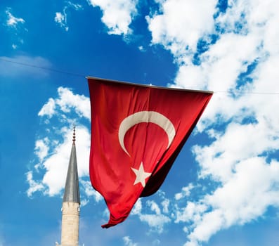 Flag of Turkey and mosque on blue sky