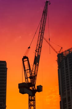 Construction site in Dubai with red sky