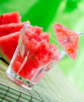 Watermelon juice on green background