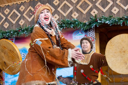 KAMCHATKA, RUSSIA - DECEMBER 24, 2021: Folk ensemble performance in dress of indigenous people of Kamchatka. Selective focus