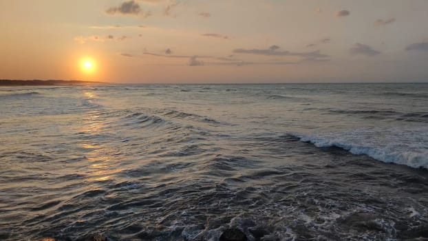 Sea sunset,sea landscape,sea water surface lit by sunset summer light
