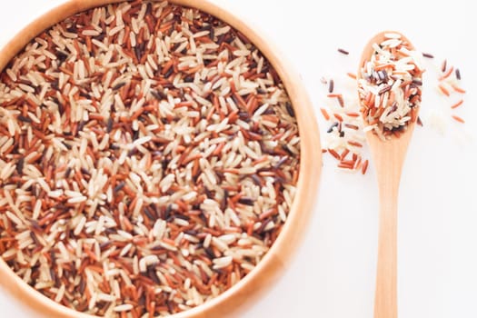 Organic Dry Multi Grain Rice in wooden bowl, stock photo