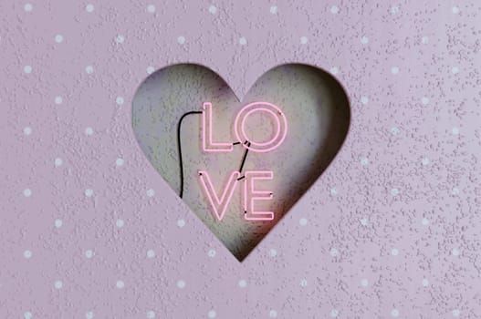 3d illustration . Hole heart shaped inside Retro neon Love sign on cement wall . CONCEPT Happy Valentine's Day.